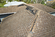 View of roof with shingles coming off